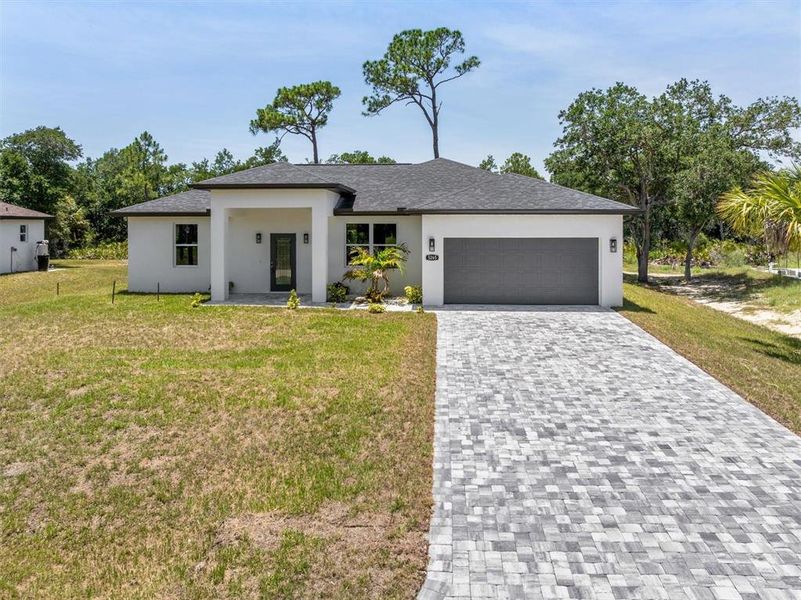 Front exterior of a new home in , North Port, FL, highlighting curb appeal (Image 21). Front exterior of a new home in , North Port, FL, highlighting curb appeal (Image 21).