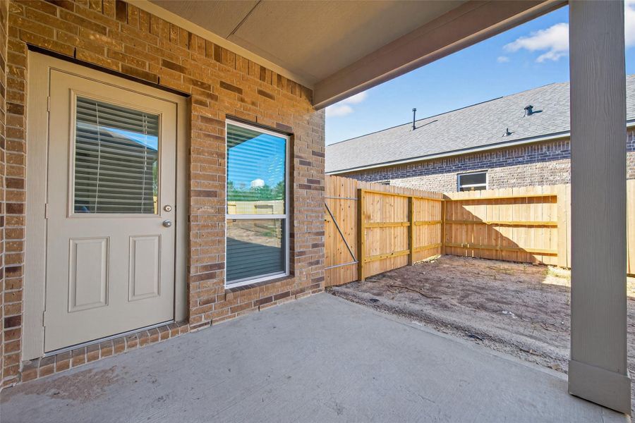 Exterior details and patio area of a home in Enclave at Willis, Willis (Image 4).