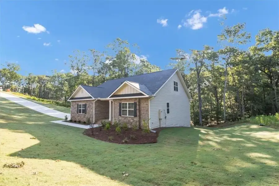 Front exterior of a new home in Tuscany Hills, Douglasville, GA, highlighting curb appeal (Image 25).
