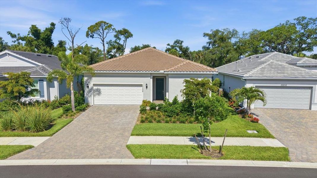 Front exterior of a new home in , Englewood, FL, highlighting curb appeal (Image 1). Front exterior of a new home in , Englewood, FL, highlighting curb appeal (Image 1).
