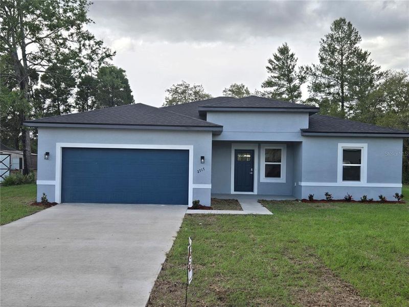 Front exterior of a new home in , Ocala, FL, highlighting curb appeal (Image 1).