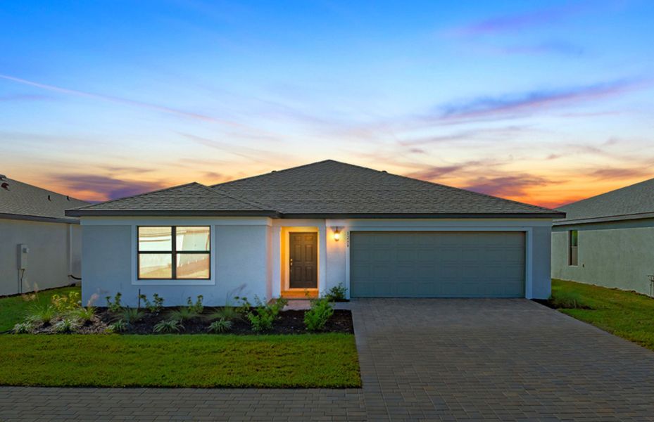 Front exterior of a new home in Caloosa Cove, Labelle, FL, highlighting curb appeal (Image 1).