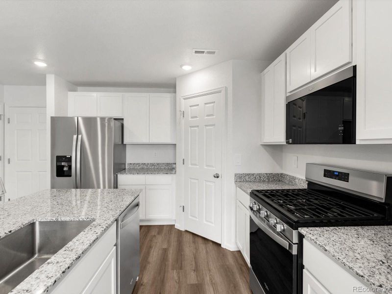 Furnished interior view inside a new home in Skyview at High Point, Aurora (Image 12).