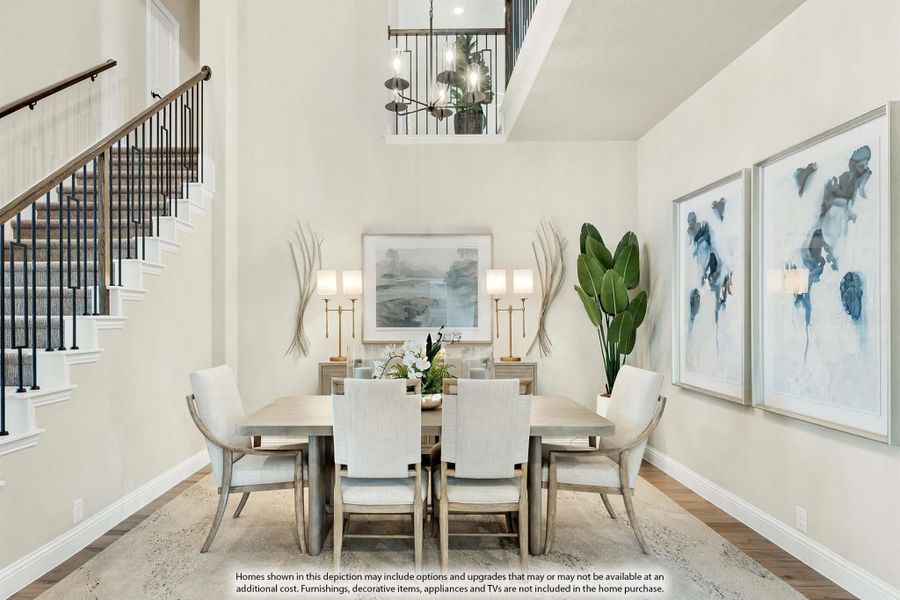 Formal dining room with six-chair table, two-story ceiling, chandelier, and staircase nearby. Formal dining room with six-chair table, two-story ceiling, chandelier, and staircase nearby.