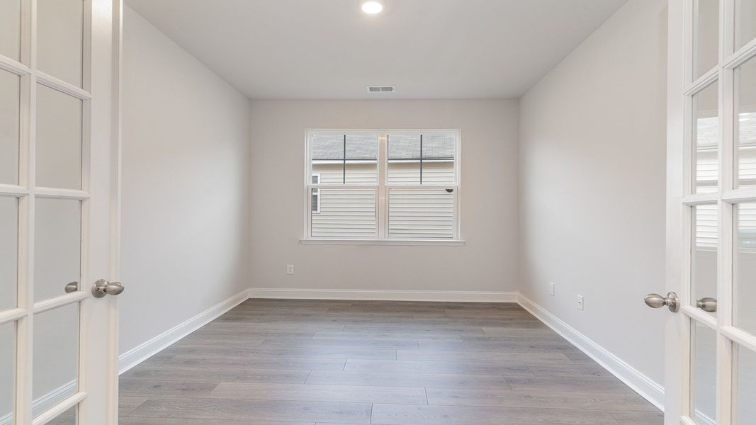 Representative unfurnished interior of a home built from the DARBY by D.R. Horton in Spring View Landing, Loris (Image 11).