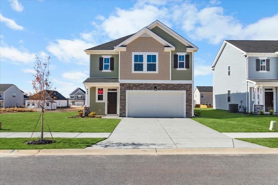 Front exterior of a new home in Windsor, North Augusta, SC, highlighting curb appeal (Image 1). Front exterior of a new home in Windsor, North Augusta, SC, highlighting curb appeal (Image 1).