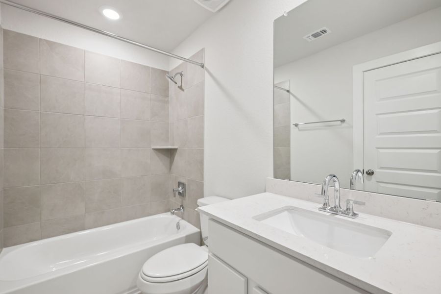 A bathroom with a sink and a bathtub.