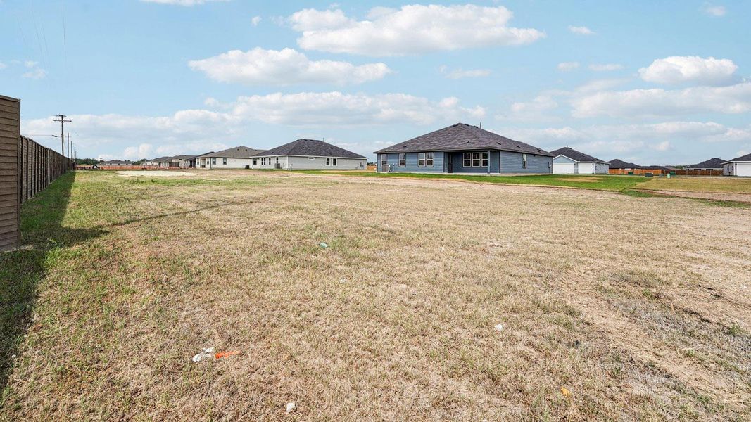 Exterior details and patio area of a home in Railhead, Cedar Creek (Image 18).