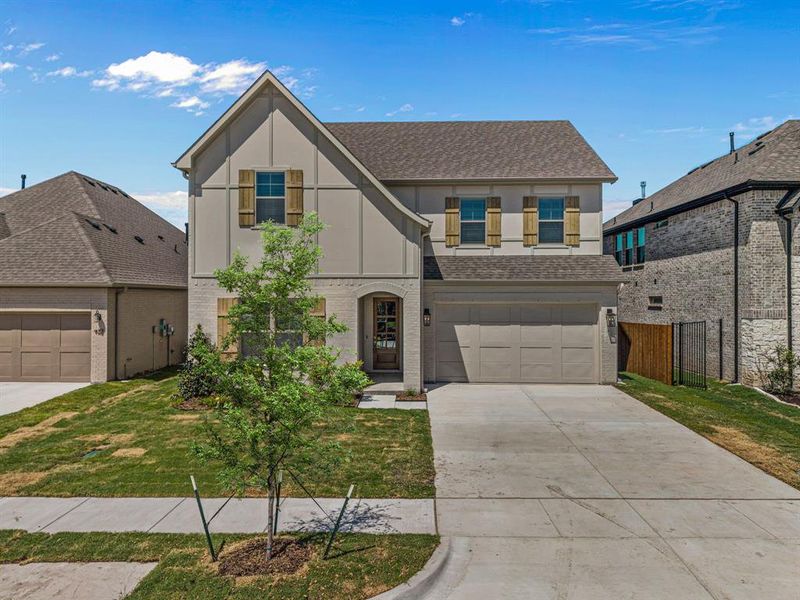 Front exterior of a new home in The Bluffs at Parks of Aledo, Aledo, TX, highlighting curb appeal (Image 2).