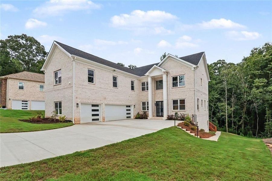Front exterior of a new home in , Fairburn, GA, highlighting curb appeal (Image 21). Front exterior of a new home in , Fairburn, GA, highlighting curb appeal (Image 21).