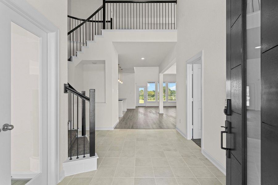 Open the door to the Wow Factor to greet your family and friends! Sweeping iron stairway! French full panel glass door for the home office! Dramatic high ceilings and more! Open the door to the Wow Factor to greet your family and friends! Sweeping iron stairway! French full panel glass door for the home office! Dramatic high ceilings and more!