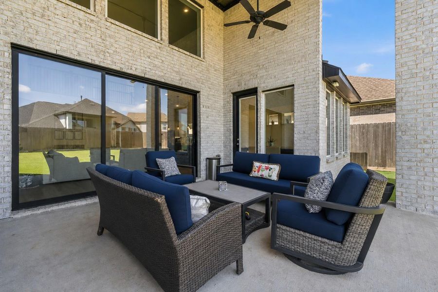 Full sliding glass doors opens to the back patio.
