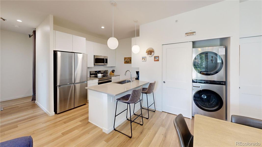 Open Floor Plan: Kitchen - Dining - Laundry