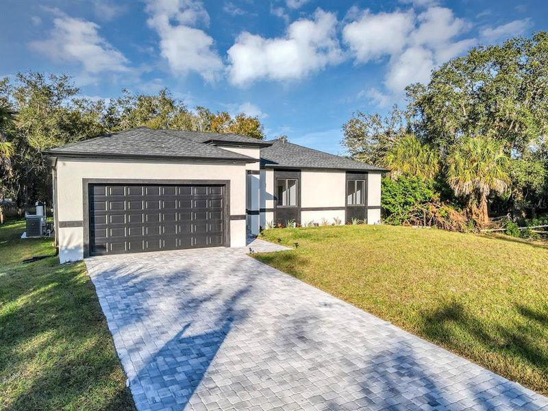 Front exterior of a new home in , Port Charlotte, FL, highlighting curb appeal (Image 2). Front exterior of a new home in , Port Charlotte, FL, highlighting curb appeal (Image 2).