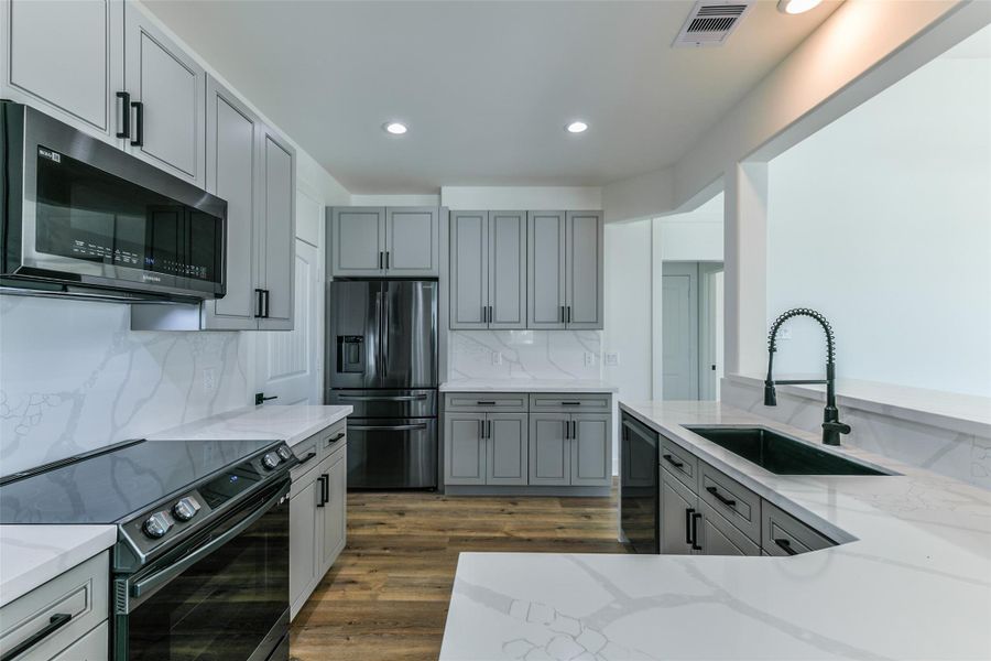 Another view of the kitchen from the dining room Another view of the kitchen from the dining room
