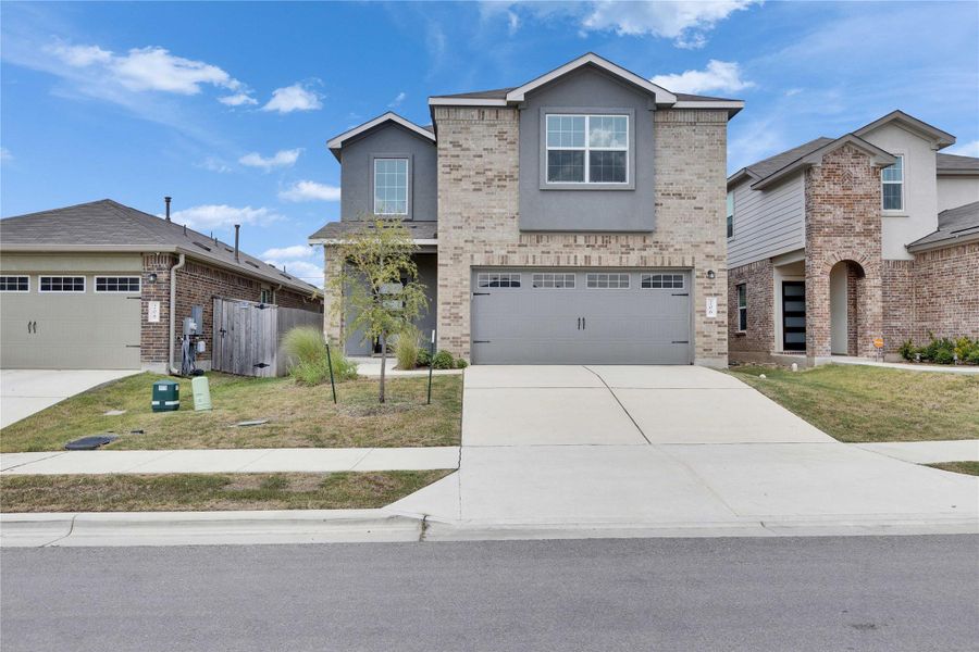 Front of home with covered entry and attached two car garage. Front of home with covered entry and attached two car garage.