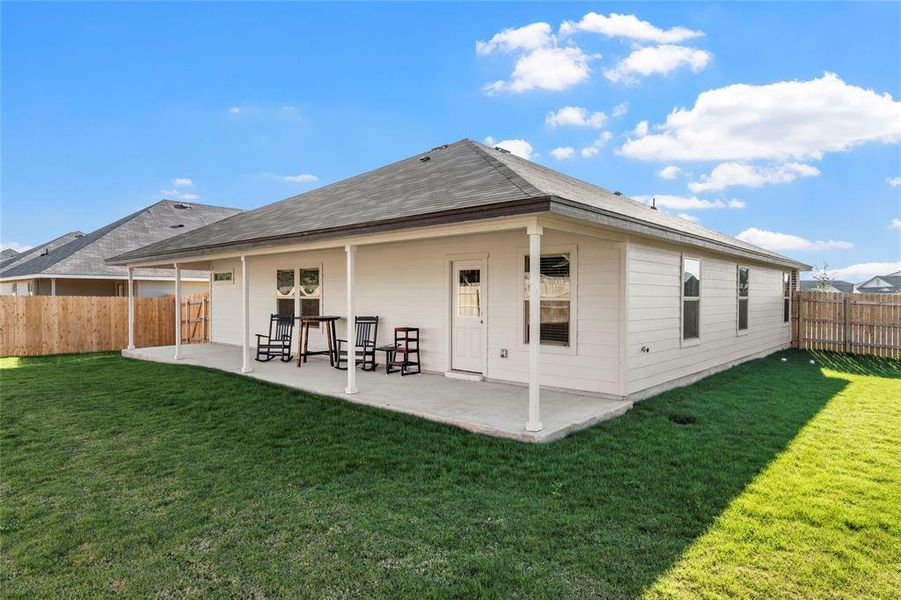 Back of property with a patio and a fenced backyard