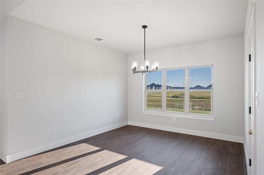 Great view from the dining room to the back yard, leads outside to the back porch for easy entertaining