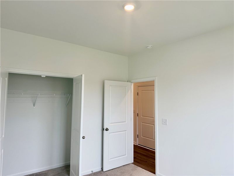 An open closet offers convenient built-in shelving
