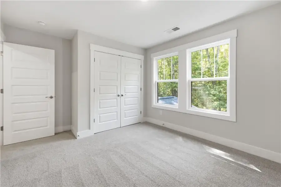 Gleaming natural light streams across soft carpeti