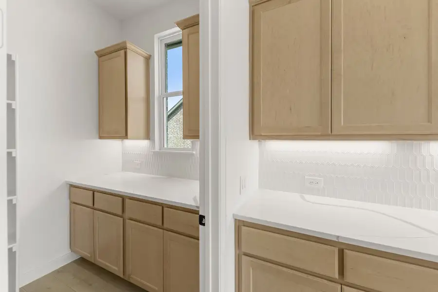 Furnished interior view inside a new home in Nelson Lake Estates, Rockwall (Image 8).