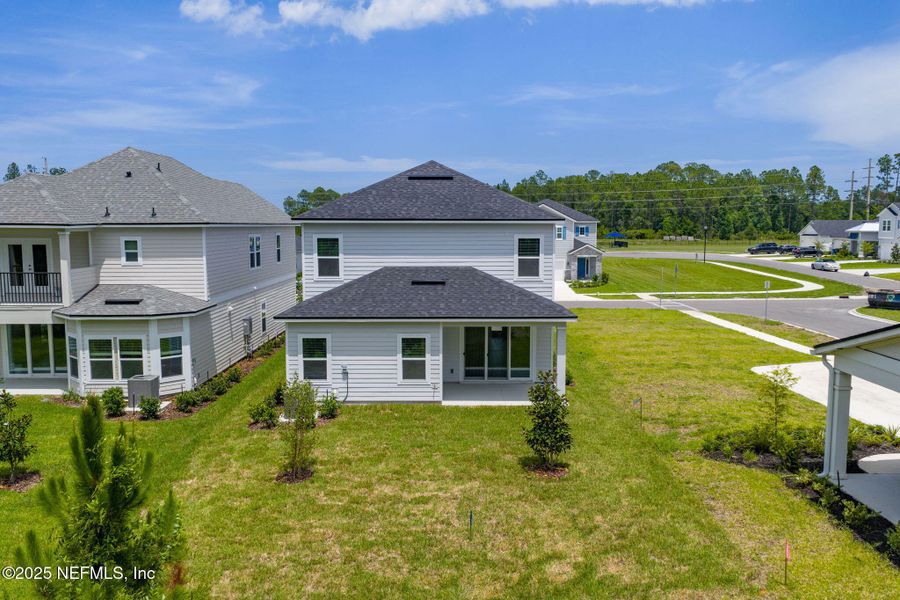 Front exterior of a new home in Beacon Lake, St. Augustine, FL, highlighting curb appeal (Image 30).