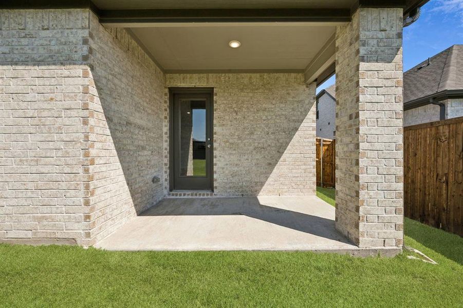 Covered Patio in the Heisman home plan by Trophy Signature Homes – REPRESENTATIVE PHOTO