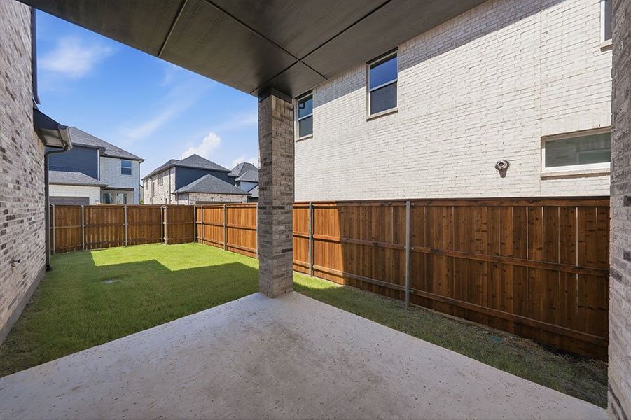 Exterior details and patio area of a home in Light Farms Brenham - 40' Lots, Celina (Image 3).