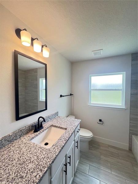Furnished interior view inside a new home in Hill Country Estates, Dade City (Image 3).