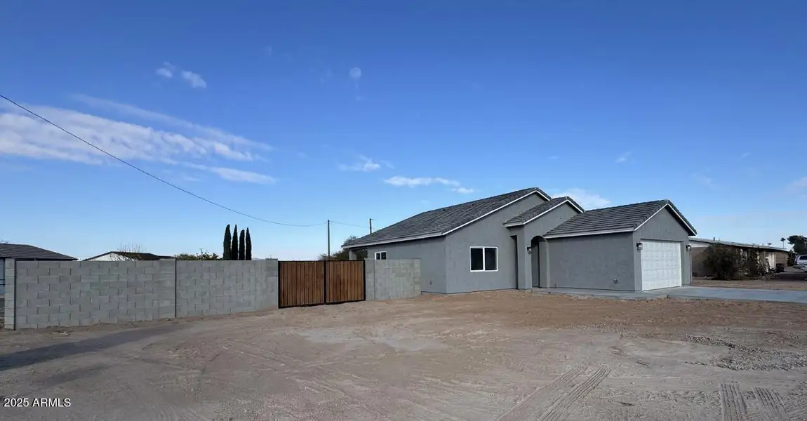 Front of home with RV gate and parking Front of home with RV gate and parking