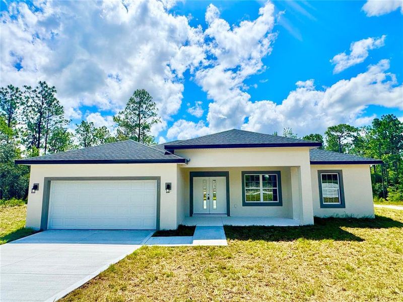 Front exterior of a new home in , Dunnellon, FL, highlighting curb appeal (Image 20).