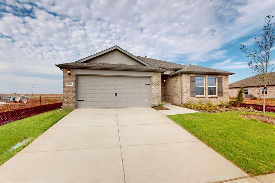 Front exterior of a new home in Mobberly Farms, Pilot Point, TX, highlighting curb appeal (Image 16). Front exterior of a new home in Mobberly Farms, Pilot Point, TX, highlighting curb appeal (Image 16).
