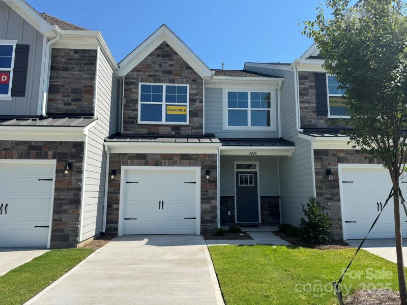 Front exterior of a new home in Harrisburg Village Townhomes, Harrisburg, NC, highlighting curb appeal (Image 21).