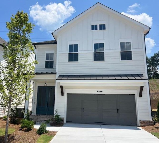 Front exterior of a new home in Palisades Single Family, Cumming, GA, highlighting curb appeal (Image 27).