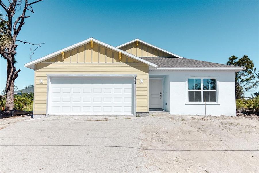 Front exterior of a new home in , Rotonda West, FL, highlighting curb appeal (Image 1).