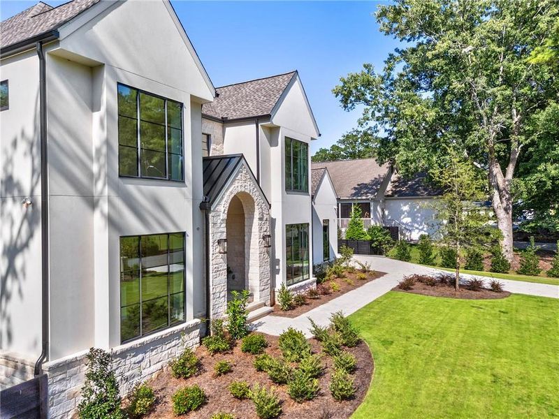 Front exterior of a new home in , Alpharetta, GA, highlighting curb appeal (Image 29). Front exterior of a new home in , Alpharetta, GA, highlighting curb appeal (Image 29).