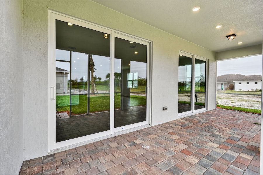 Exterior details and patio area of a home in Del Webb Tradition, Port St. Lucie (Image 34).