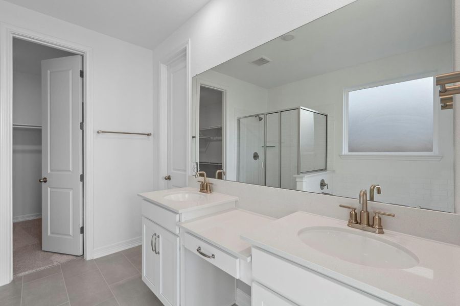 The en-suite bathroom offers a spa-like atmosphere with its elegant design, high end finishes, and tasteful lighting, creating a retreat within your own home. The en-suite bathroom offers a spa-like atmosphere with its elegant design, high end finishes, and tasteful lighting, creating a retreat within your own home.