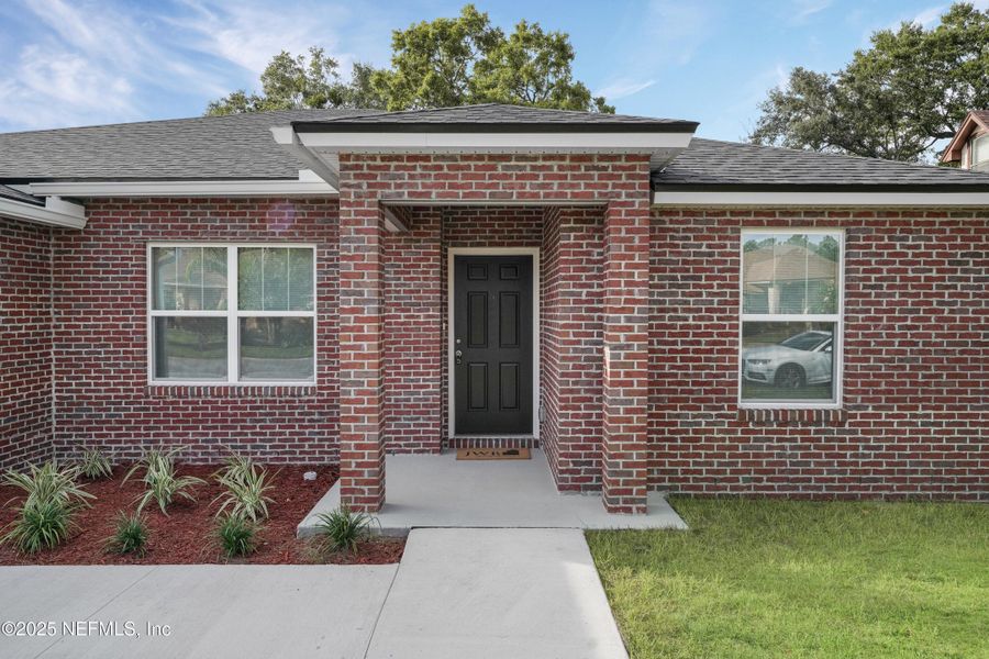 Front exterior of a new home in , Jacksonville, FL, highlighting curb appeal (Image 19).