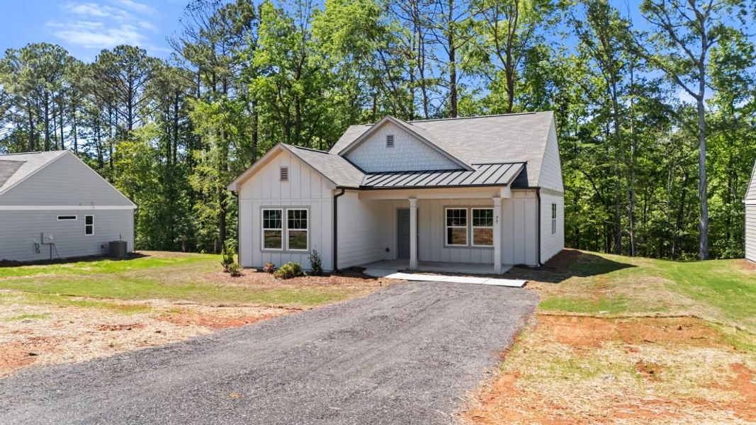 Front exterior of a new home in Clemit Harris Place, Newnan, GA, highlighting curb appeal (Image 4). Front exterior of a new home in Clemit Harris Place, Newnan, GA, highlighting curb appeal (Image 4).