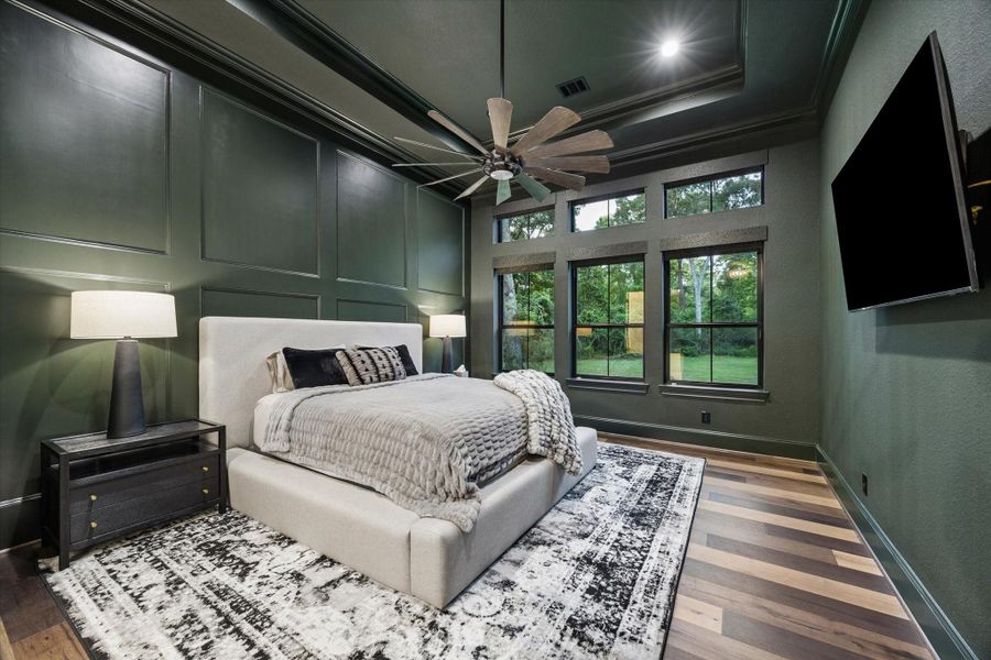 Rich designer tones and serene backyard views transform the primary suite into a sophisticated private sanctuary. Every finish has been thoughtfully curated to create an elegant balance of warmth, comfort, and contemporary luxury. Elevated ceilings, abundant natural light, and refined architectural details enhance the tranquil atmosphere, while the spacious layout provides a peaceful retreat designed for relaxation and everyday indulgence. This exceptional owner's suite offers the perfect blend.