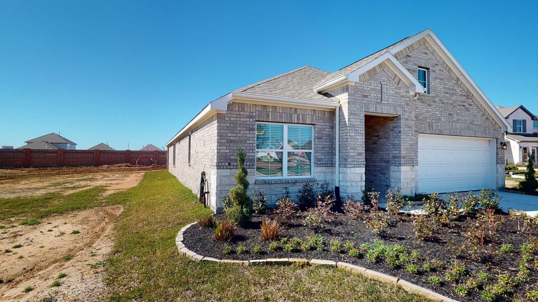 Representative exterior photo of a completed home built from the Floor Plan 2121 by Colina Homes in Grand Magnolia, Magnolia, TX (Image 2). Representative exterior photo of a completed home built from the Floor Plan 2121 by Colina Homes in Grand Magnolia, Magnolia, TX (Image 2).