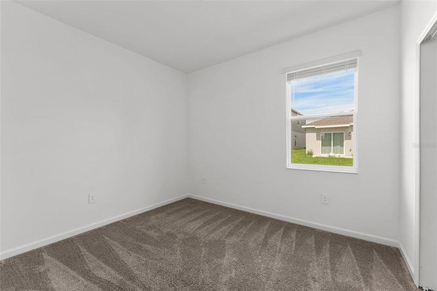 Spacious, unfurnished interior of a new home in Peace Creek Reserve, Winter Haven (Image 26).