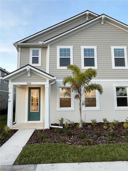 Front exterior of a new home in Meridian Parks, Orlando, FL, highlighting curb appeal (Image 1).