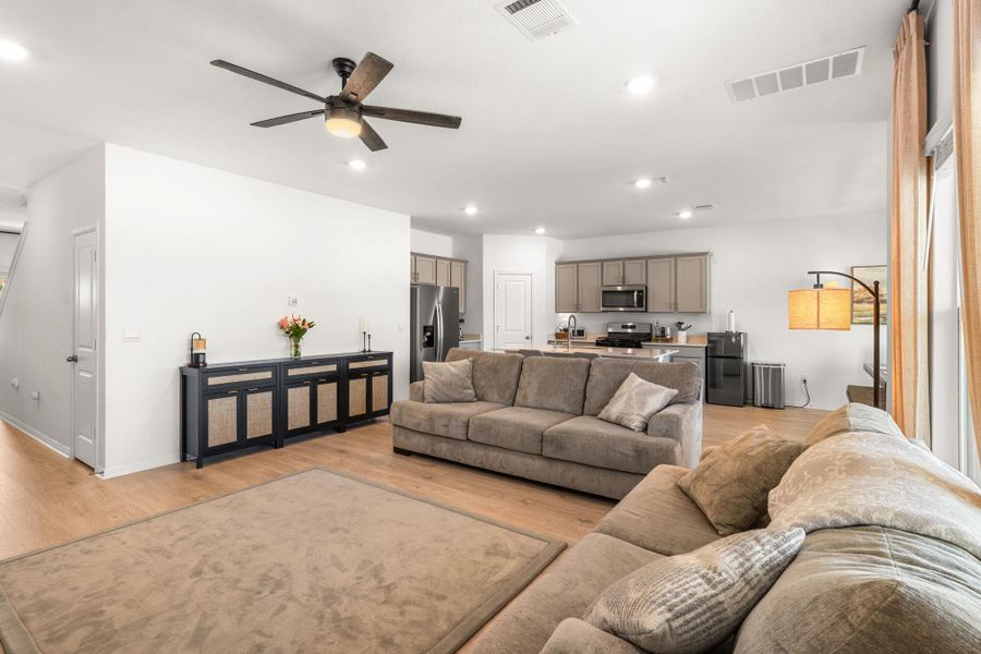 An open-concept living area flows into a well-appointed kitchen, ideal for entertaining. An open-concept living area flows into a well-appointed kitchen, ideal for entertaining.