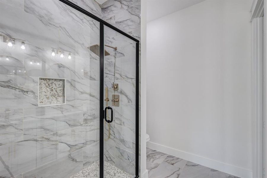 Bathroom with an enclosed shower and toilet