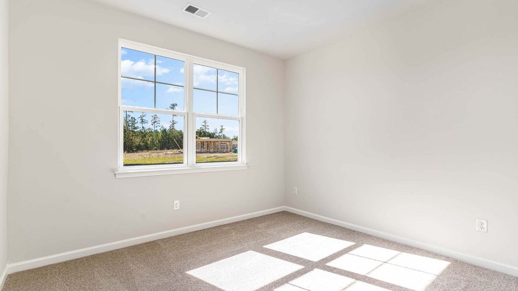 Representative unfurnished interior of a home built from the ARIA by D.R. Horton in Sandridge Park, Little River (Image 11).
