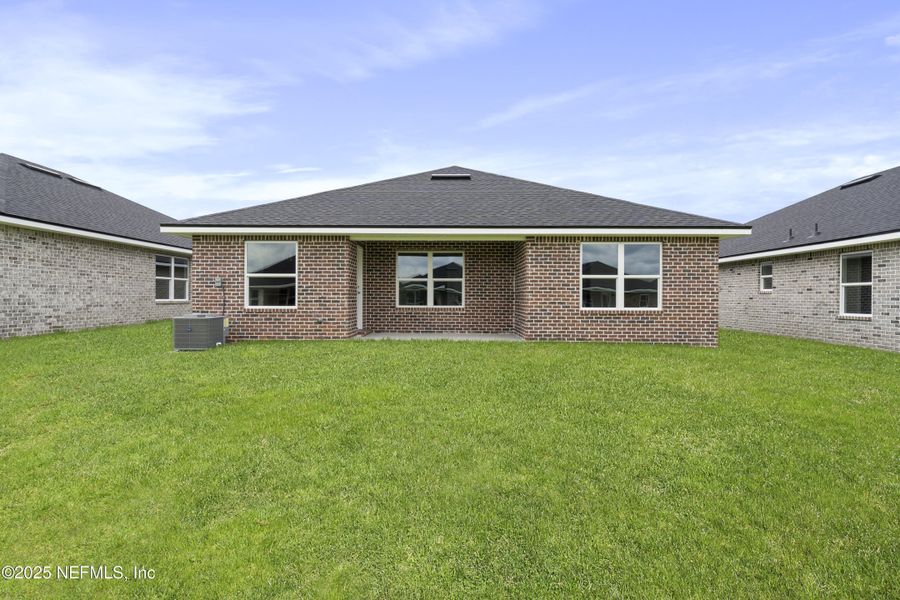 Front exterior of a new home in Shadow Crest at Rolling Hills, Green Cove Springs, FL, highlighting curb appeal (Image 17).