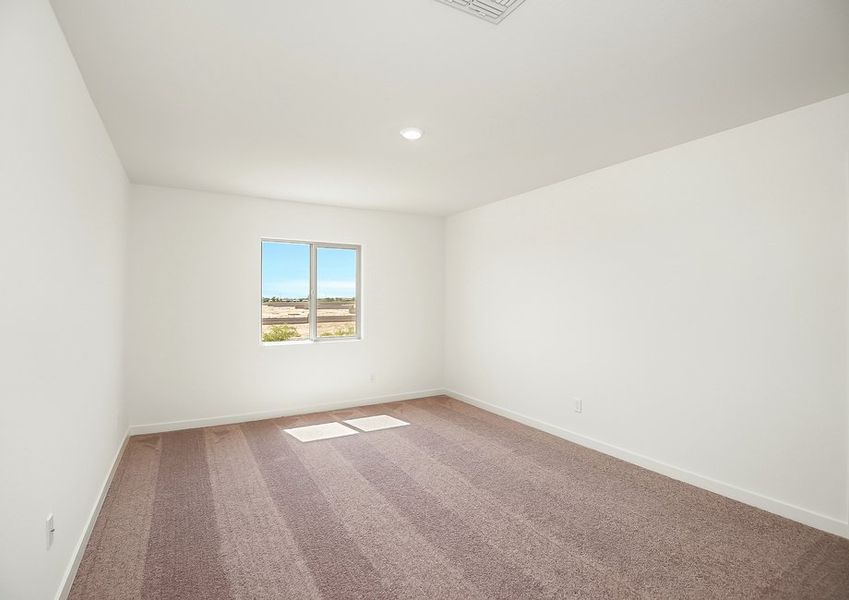 Carpeted secondary bedroom with window in Wellton floor plan
