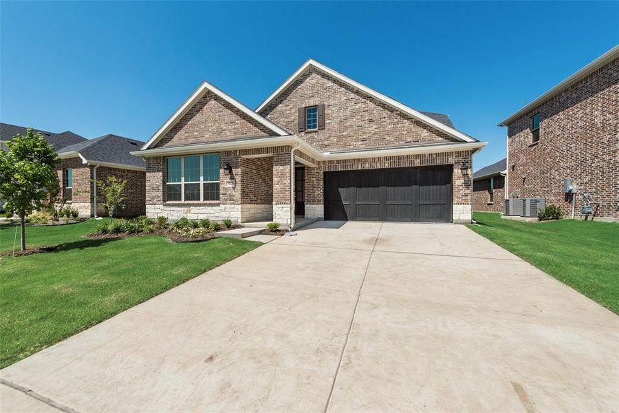 Front exterior of a new home in Sutton Fields, Celina, TX, highlighting curb appeal (Image 2).